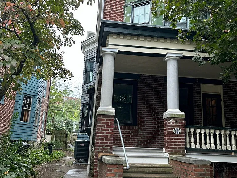 Freshly painted exterior and rebuilt front porch