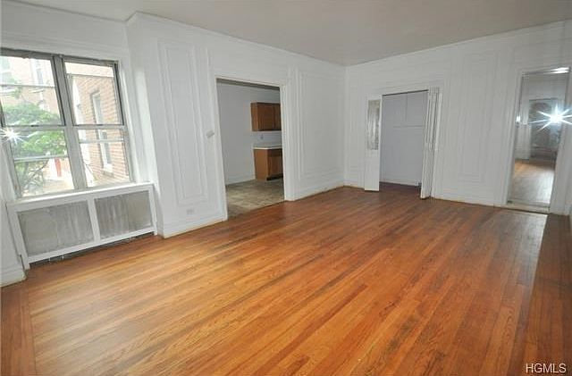 Large Living Room with refinished hardwood floors.