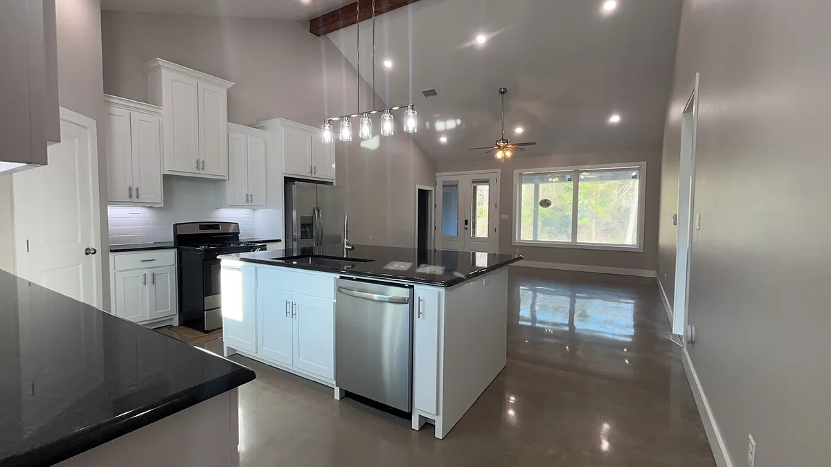 Large island with pull out trash can and dishwasher. - 12546 Vinson Cir