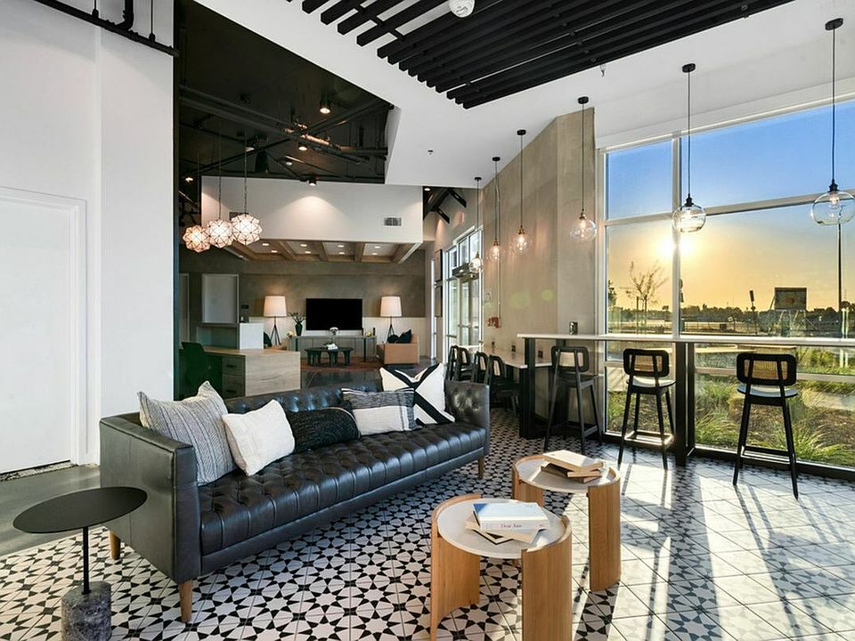 Experience luxury and style in this contemporary lounge, perfectly designed for relaxation and socializing at 805 Riverfront Apartments in Sacramento