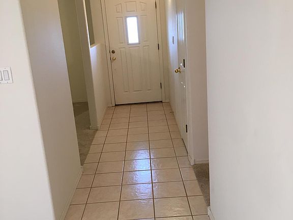 entry door, entry, custom overhead entry lighting. LR access, then to hall, then kitchen.