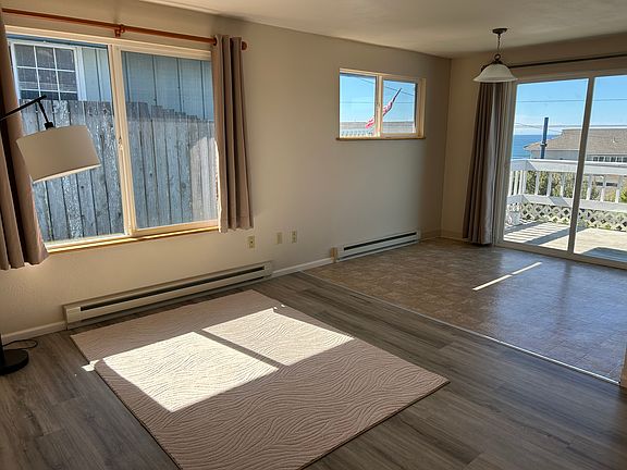 Upper level living & dining area, with sliding glass door to deck