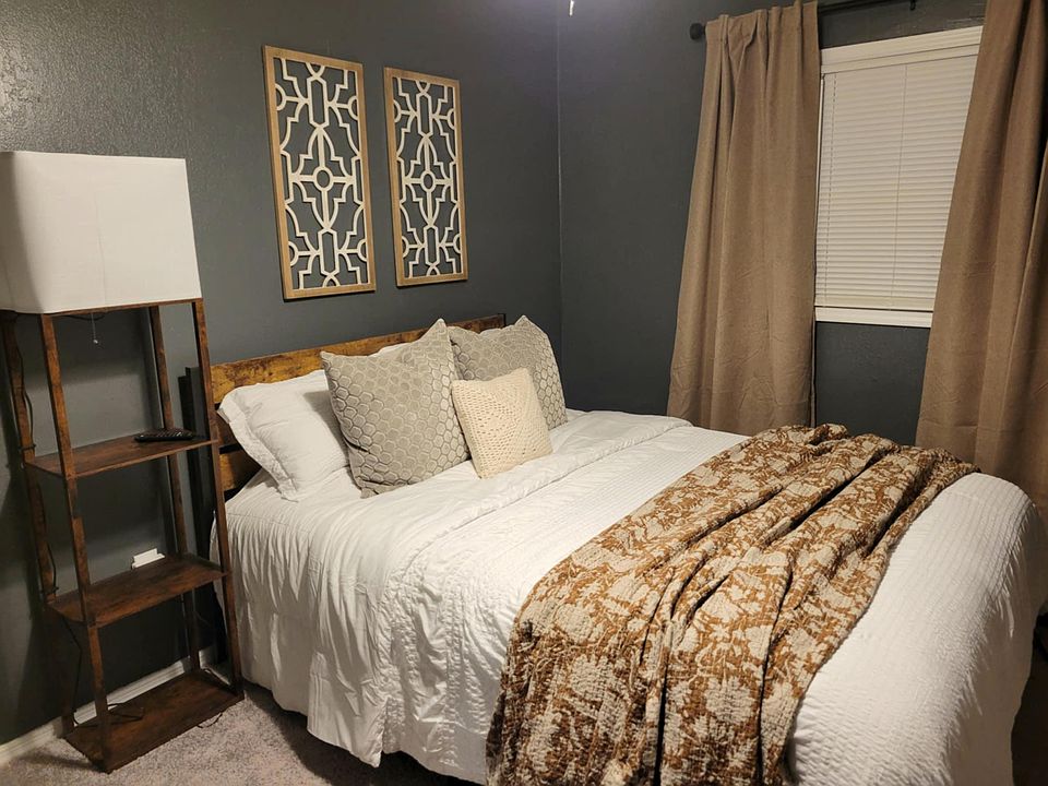 Main floor bedroom with private full bath located around the corner.