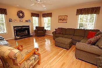 Family Room with Gas Fireplace and Hardwoods Floors