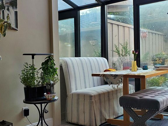 Breakfast nook/sunroom looking out to large patio.