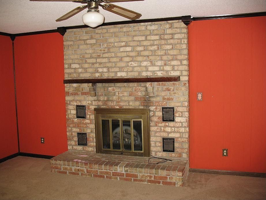 den with brick fireplace