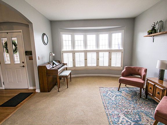 Front room with beautiful windows and shutters