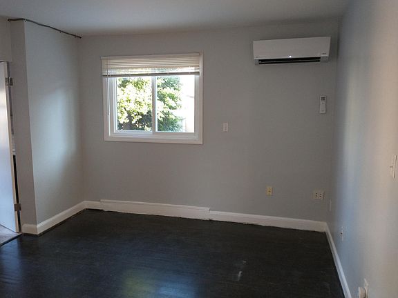 Living/Dining Area showing newly installed air conditioning/heating unit. Super quiet...listen closely, you can't even hear the A/C