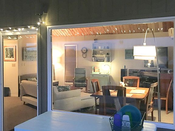 From the deck into living room at dusk.