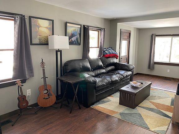 Living room space, window by door has view of lake.