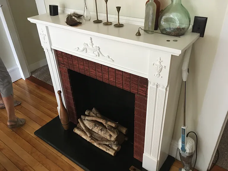 Fake fireplace. (Real fireplace in a rental is not affordable due to insurance.)
