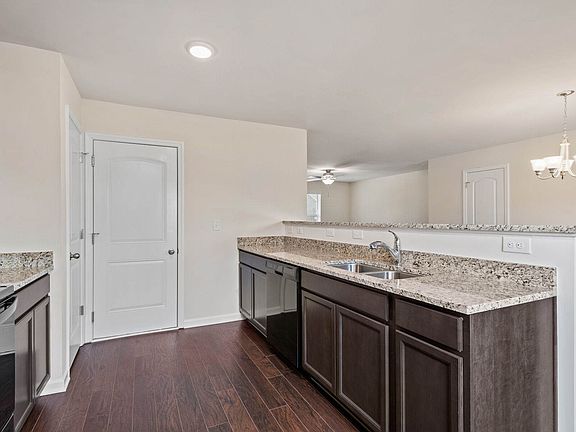 The kitchen is open to the dining area.