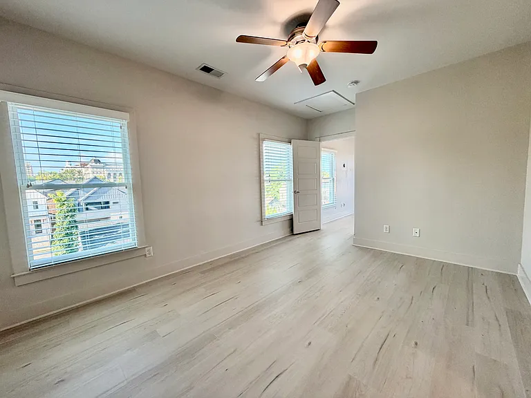 The fourth bedroom is attached to the living area, which opens to the deck