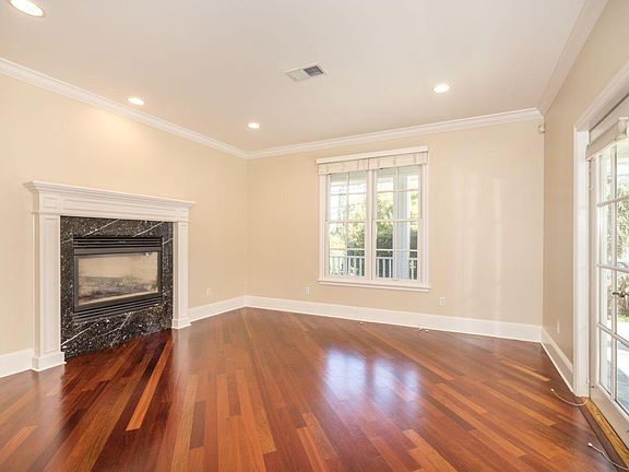 Living room with gas fireplace, looking towards the street