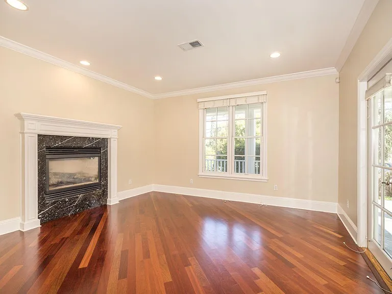 Living room with gas fireplace, looking towards the street