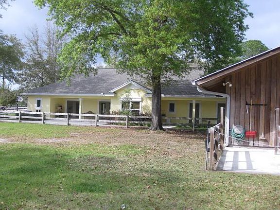 Southside with back porch to the right, view from the barn