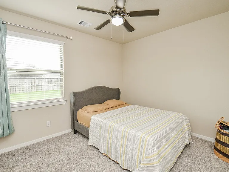 Guest room downstairs. Spacious. This picture shows a QUEEN size bed for context.