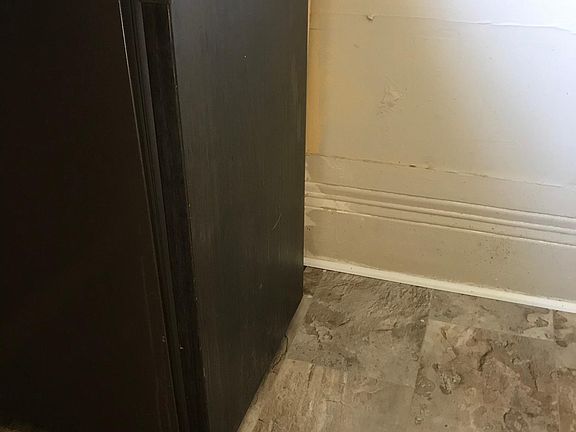 Small fridge located under the bar area