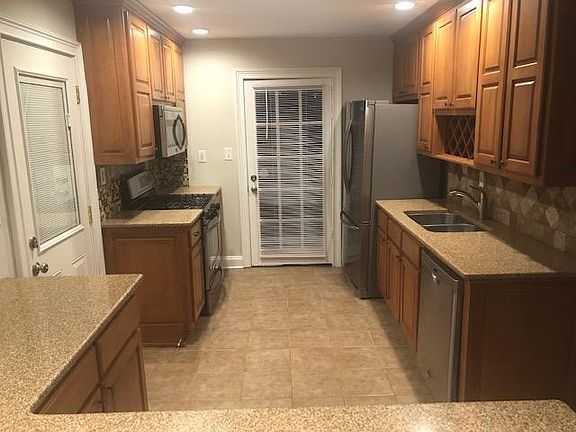 Kitchen with granite counters and newer appliances