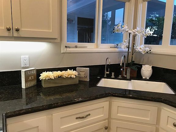 Kitchen w/wine fridge, step to outdoor dining