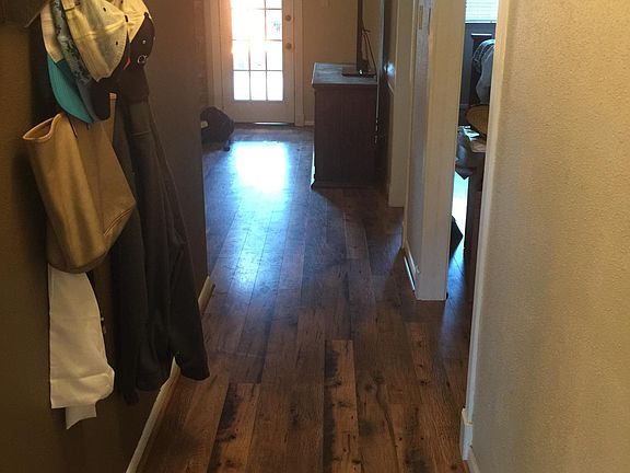 Entry way into home. Kitchen to the left. 1st bedroom to the right.