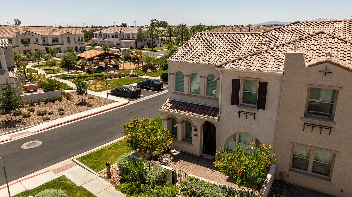 Arched windows with shutters, paved courtyard and park views. - 4077 S Sabrina Dr #20