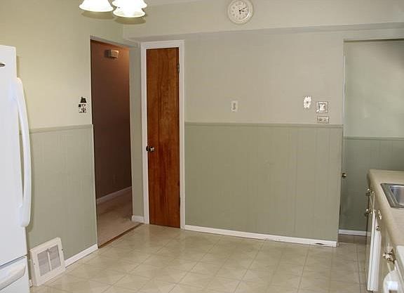 Pantry and access to the deck and backyard from the kitchen