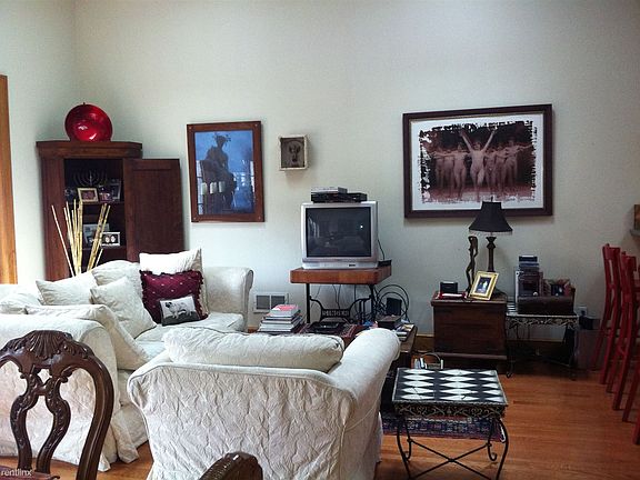 Open format living room boasts 14" soaring ceiling height