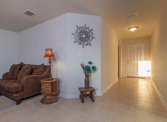 Hallway from front door leads to family room. Plenty of natural light.