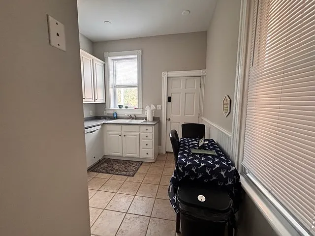 Cozy three people table in the kitchen as you walk into the kitchen.