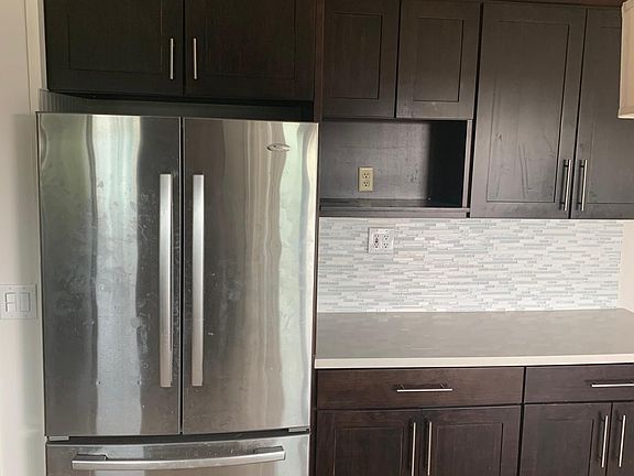 Full kitchen with stainless steel appliances