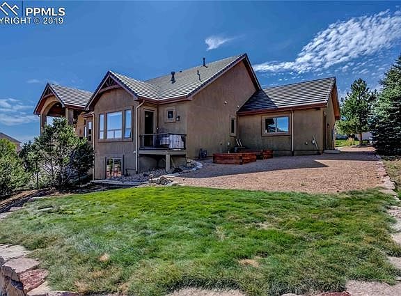 Back & side of the house. Small deck is off of the master bedroom.