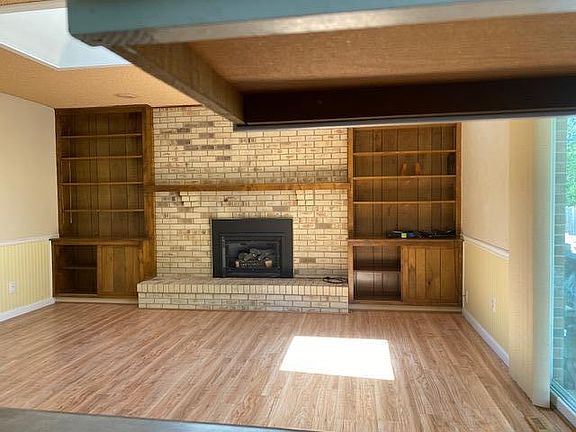 Family room off the Kitchen with access to the garage and backyard