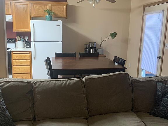 standing in living room looking into dining area