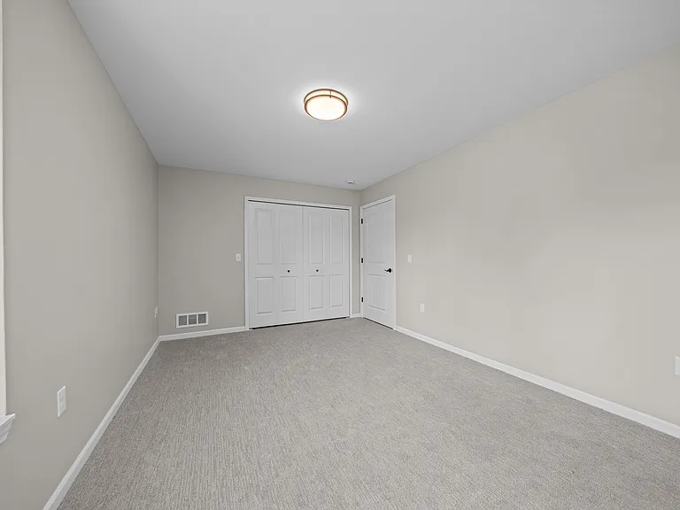 Bedroom with Ample storage space at The Reserve at Prentiss Pointe Apartments in Harrison Township, MI