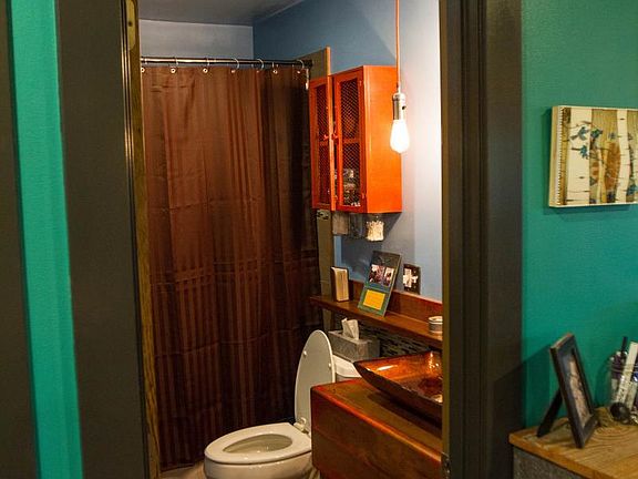 Main floor bathroom with custom tile, vanity and woodwork