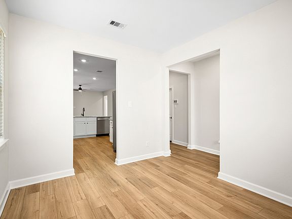 The opening between the kitchen and dining room makes hosting easy