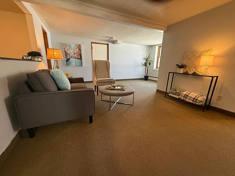 L-shaped family room has a nice sized nook that could be office, playroom or maybe a spot for a pullout for extra sleeping space?