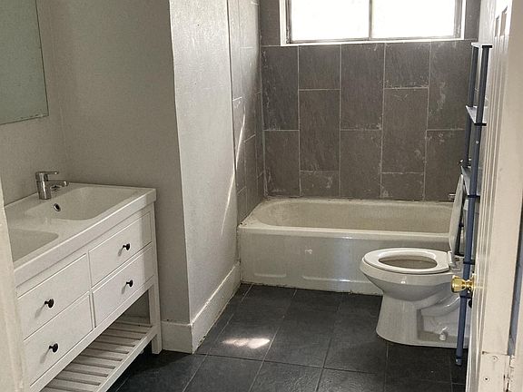 Bathroom with new tile, double vanity and lots of storage!