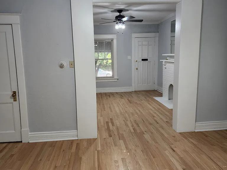 View from the middle room looking back towards the front room. 2 closets in this room.