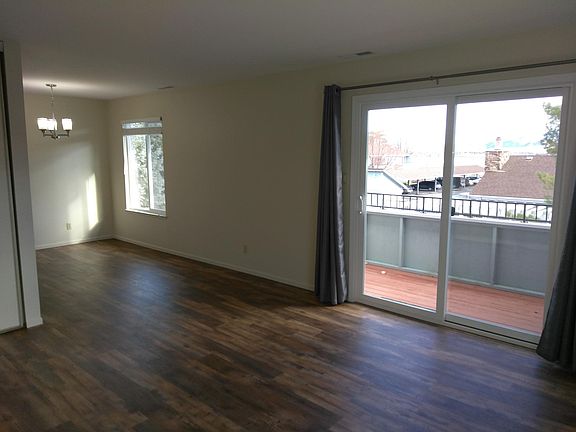 New flooring, large living with slide-out doors to outside u