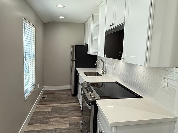 Kitchen includes brand new: 
GE Dishwasher, Whirlpool Microwave, GE Fridge, GE Oven Range & Electric Stove Top