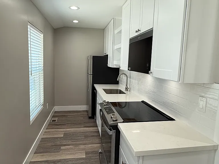 Kitchen includes brand new: 
GE Dishwasher, Whirlpool Microwave, GE Fridge, GE Oven Range & Electric Stove Top
