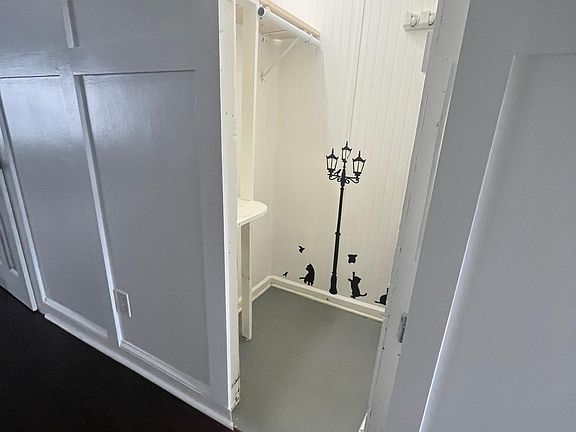 Hidden panel in the wall. Can be used for pet room (small pet door installed) or extra storage