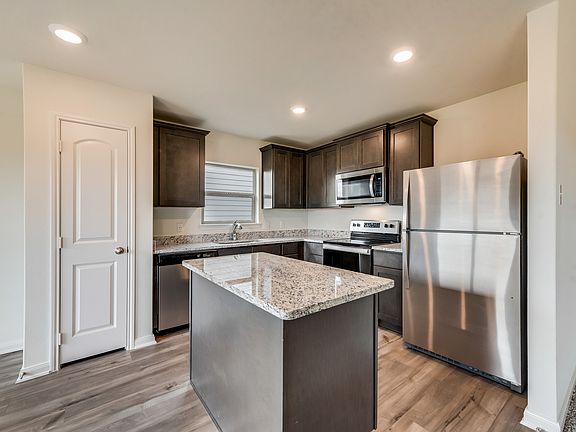 The kitchen comes with a full suite of energy-efficient appliances