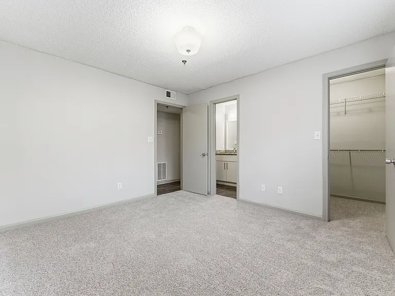 Relax in a serene bedroom retreat with ample space
