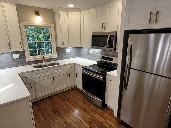 New kitchen with induction cooktop and quartz counters