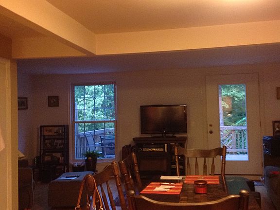 view from kitchen to living room which opens to the deck