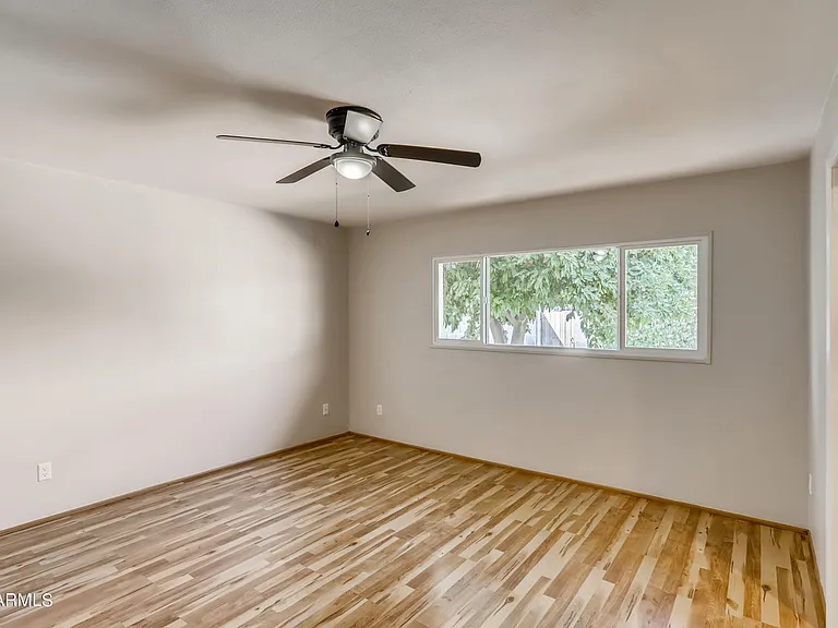 Large primary bedroom suite includes walk-in closet with built in shelves + an additional extra-large closet and private bathroom with tiled shower.