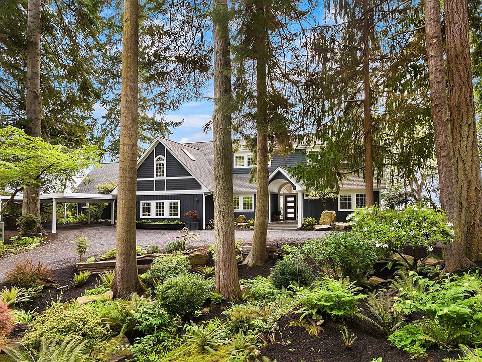 home sited on sized 1.8 acre parcel in coveted Rolling Bay.